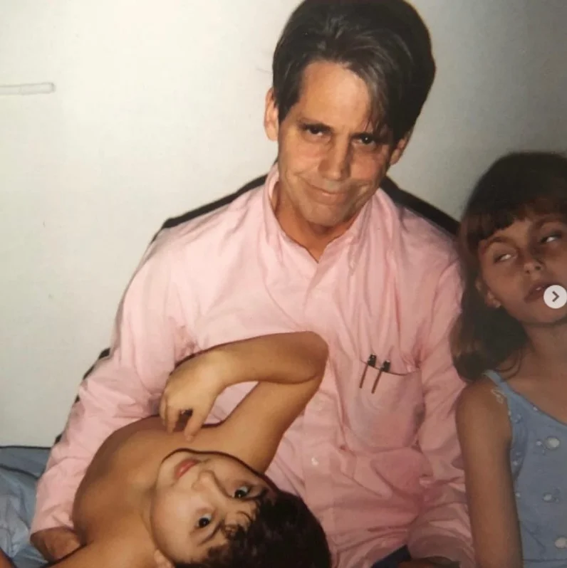Childhood photo of Annie Hamilton with her dad and brother